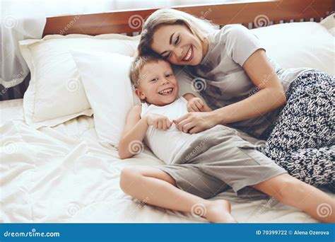 mom and son play|Mom Son Play On Bed royalty.